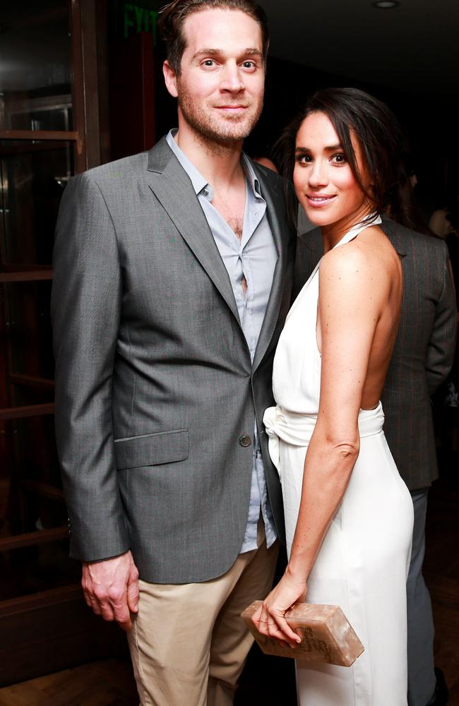This is pretty much the only photo of Cory and Meghan together taken at an event in December 2014. Picture: Ben Rosser/BFA/Shutterstock