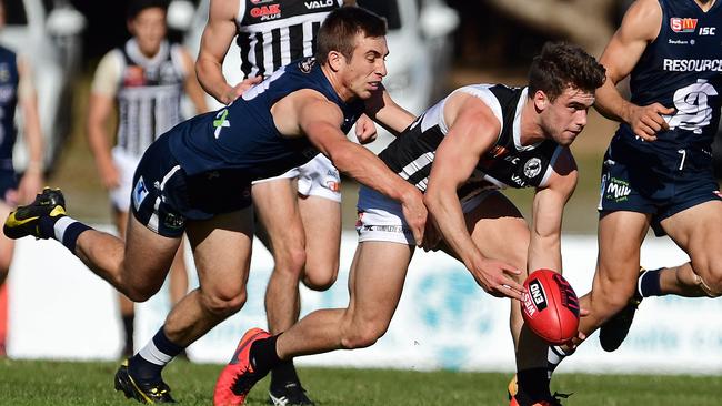 South's Joel Cross tackles Port Adelaide’s Will Snelling. Picture: Tom Huntley