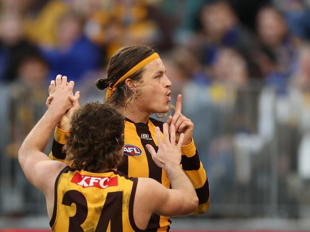 Jack Ginnivan shushes the crowd after kicking a goal Will Russell/AFL Photos via Getty Images)