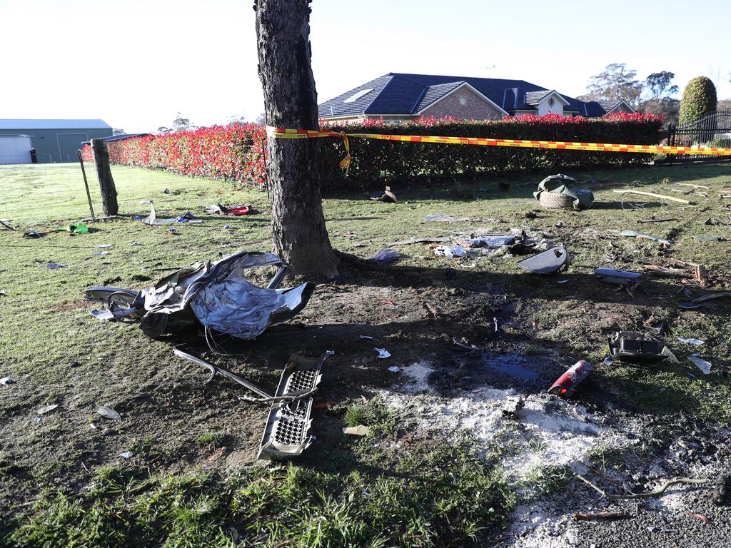 Debris strewn across the grass from the crash. Picture: John Grainger