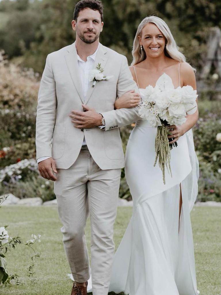 Boak walking Cassie down the aisle last year. Picture: Captured by Georgie