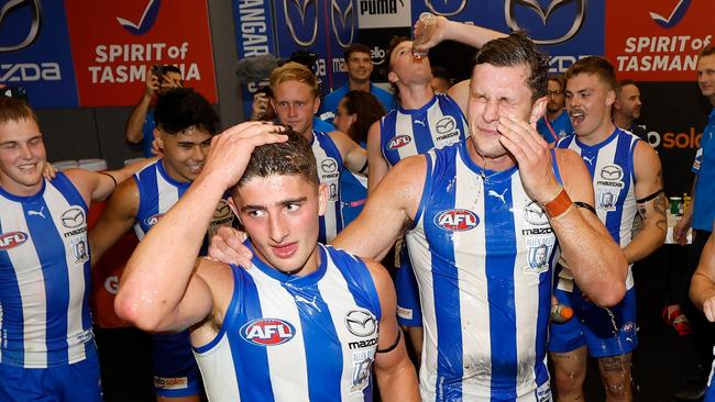 MELBOURNE, AUSTRALIA – MARCH 18: Harry Sheezel (left) and Charlie Comben of the Kangaroos sing the team song during the 2023 AFL Round 01 match between the North Melbourne Kangaroos and the West Coast Eagles at Marvel Stadium on March 18, 2023 in Melbourne, Australia. (Photo by Michael Willson/AFL Photos via Getty Images)