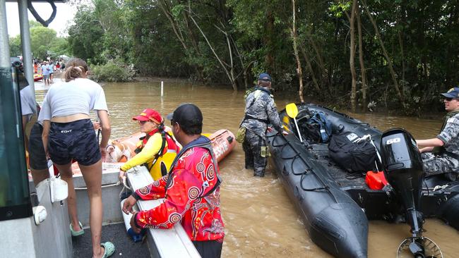 SES crews evacuated flood victims from Holloways Beach. Picture: Peter Carruthers