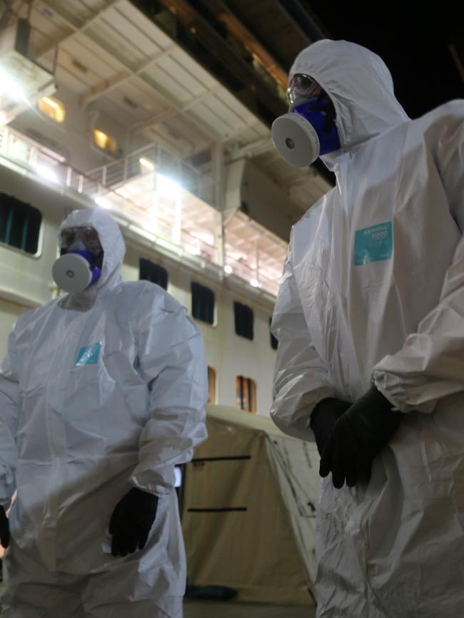 NSW Police wearing hazmat suits board the Ruby Princess. Picture: NSW Police