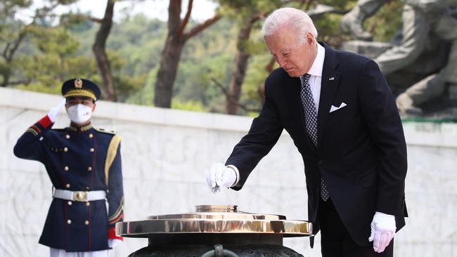 Joe Biden burns incense during a visit to Seoul National Cemetery on Saturday. Picture: Getty Images