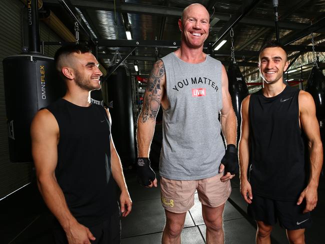 Barry Hall with boxing twins Andrew (left) and Jason Moloney. Picture: Adam Head