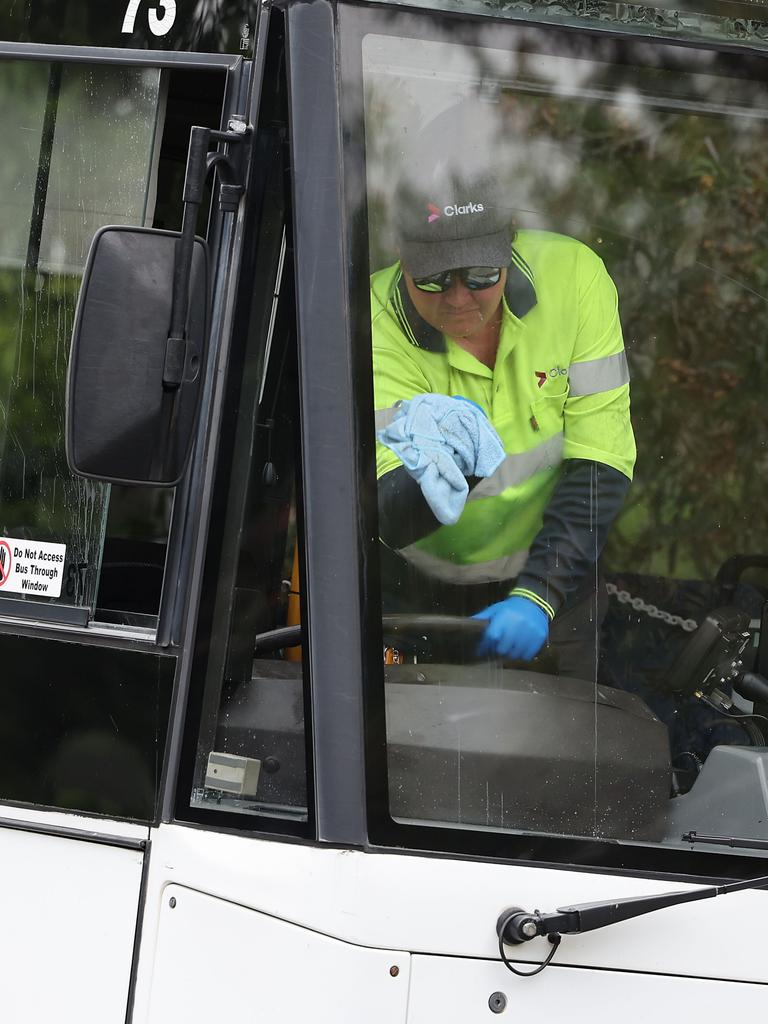 A worker cleans the bus after the attack.