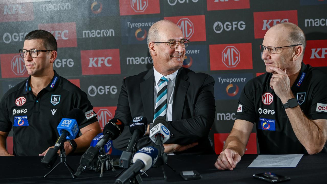 ADELAIDE, AUSTRALIA – FEBRUARY 12: Josh Carr senior assistant coach of Port Adelaide, Port Adelaide Football Club chairman David Koch and Ken Hinkley senior coach of Port Adelaide speak to the media during a Port Adelaide Power AFL press conference at Alberton Oval on February 12, 2025 in Adelaide, Australia. (Photo by Mark Brake/Getty Images)