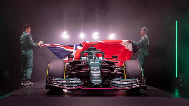 Lance Stroll and Sebastian Vettel unveil the Aston Martin car the upcoming Formula One season. Picture: AFP