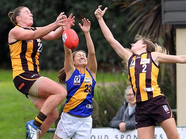 Tamara Luke, Morgan Lowe and Kara Henderson in action during the  VFLW: Hawthorn v Williamstown football match in Box Hill, Saturday, June 1, 2019.  Picture: Andy Brownbill