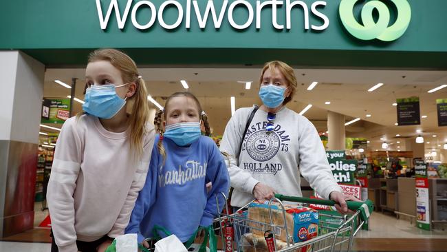 Susan Duffy with grandkids Alexis (pink top) and Imogen Schroder (blue top) at Woolworths store. Picture: Sam Ruttyn