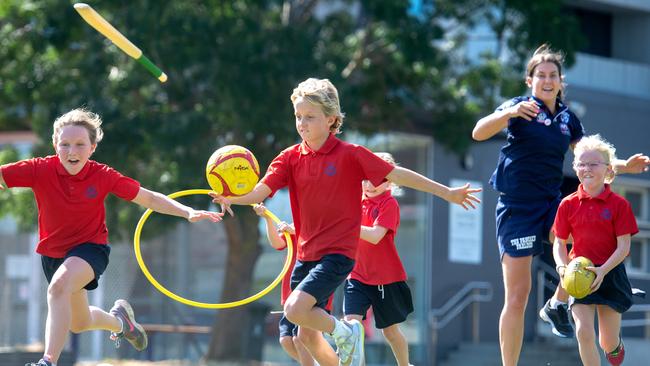 AFLW Bulldogs player Libby Birch and Sacred Heart Primary School students. Picture: Jay Town