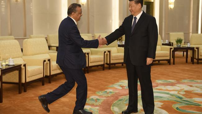 WHO director general Tedros Adhanom shakes hands with Chinese President Xi Jinping in the Great Hall of the People in Beijing,. Picture: AP.