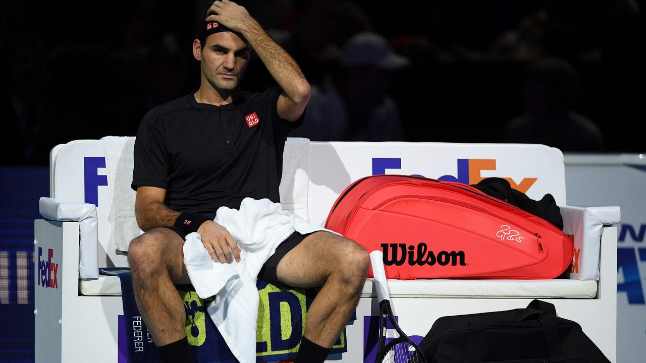 Switzerland's Roger Federer takes a break as he plays against Greece's Stefanos Tsitsipas during the men's singles semi-final match on day seven of the ATP World Tour Finals tennis tournament at the O2 Arena in London on November 16, 2019. (Photo by Daniel LEAL-OLIVAS / AFP)