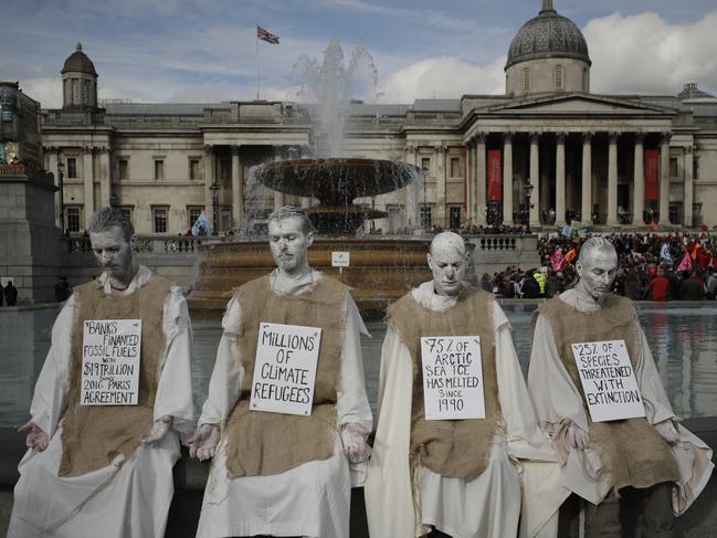 Extinction Rebellion climate change protesters demonstrate during a rally in Trafalgar Square, London, Wednesday, Oct. 16, 2019.  Climate protesters in London have kept up their campaign despite being ousted by a police order from their Trafalgar Square encampment on Monday. (AP Photo/Matt Dunham)