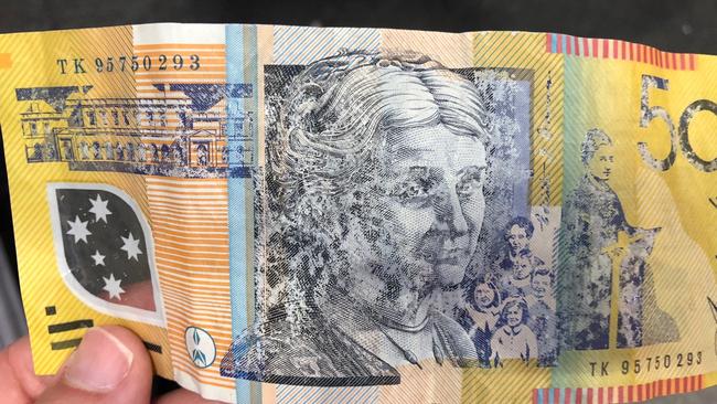 An example of a suspect $50 note found.