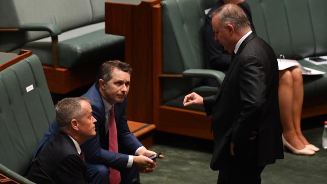 Former leader of the opposition Bill Shorten and Leader of the Opposition Anthony Albanese with front bencher Jason Clare during Question Time on Thursday.