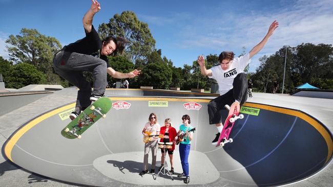 SPRINGTIME free festival had a variety of bands as well as skaters. Skateboarders Blake Gibbards (black) and Sam Windhorst (white) get some practice skating around Greatest Hits band members Ryan Carins, Chelsea Foley and Henry Chatham at the Pizzey Park Skatepark. Picture Glenn Hampson