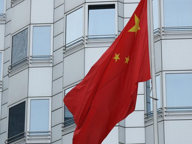 BERLIN, GERMANY - DECEMBER 11:  A Chinese flag flies at the Chinese Embassy on December 11, 2017 in Berlin, Germany. Hans-Georg Maassen, the head of the German intelligence service, the BvG (Bundesamt fuer Verfassungsschutz), has accused China of seeking to spy on German politicians and institutions by setting up fake accounts on LinkedIn and other social media for recruitment purposes.  (Photo by Sean Gallup/Getty Images)