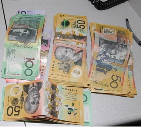 Police seized cash believed to be proceeds of crime in a raid.