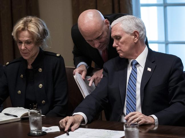 Debbie Birx, White House Corona Virus Response Coordinator, looks on as Vice President Mike Pence and his chief of staff Marc Short confer during a meeting. Picture: AFP