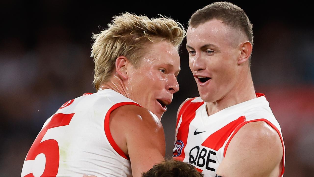 MELBOURNE, AUSTRALIA - MARCH 15: Chad Warner of the Swans celebrates a goal with teammate Isaac Heeney during the 2024 AFL Round 01 match between the Collingwood Magpies and the Sydney Swans at the Melbourne Cricket Ground on March 15, 2024 in Melbourne, Australia. (Photo by Dylan Burns/AFL Photos via Getty Images)