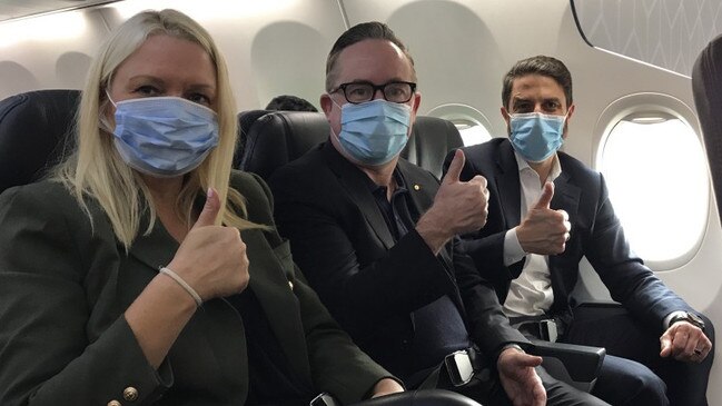 Qantas chief executive Alan Joyce, centre, with chief customer officer Stephanie Tully and Qantas International chief executive Tino La Spina on a Sydney to Melbourne flight on Friday.