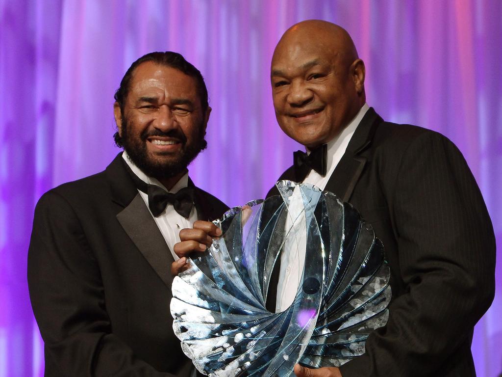 U.S. Republican Al Green presents a Phoenix award to former boxer George Foreman at the Congressional Black Caucus Foundation Annual Phoenix Awards dinner on September 24, 2011 in Washington, DC. Picture: AFP