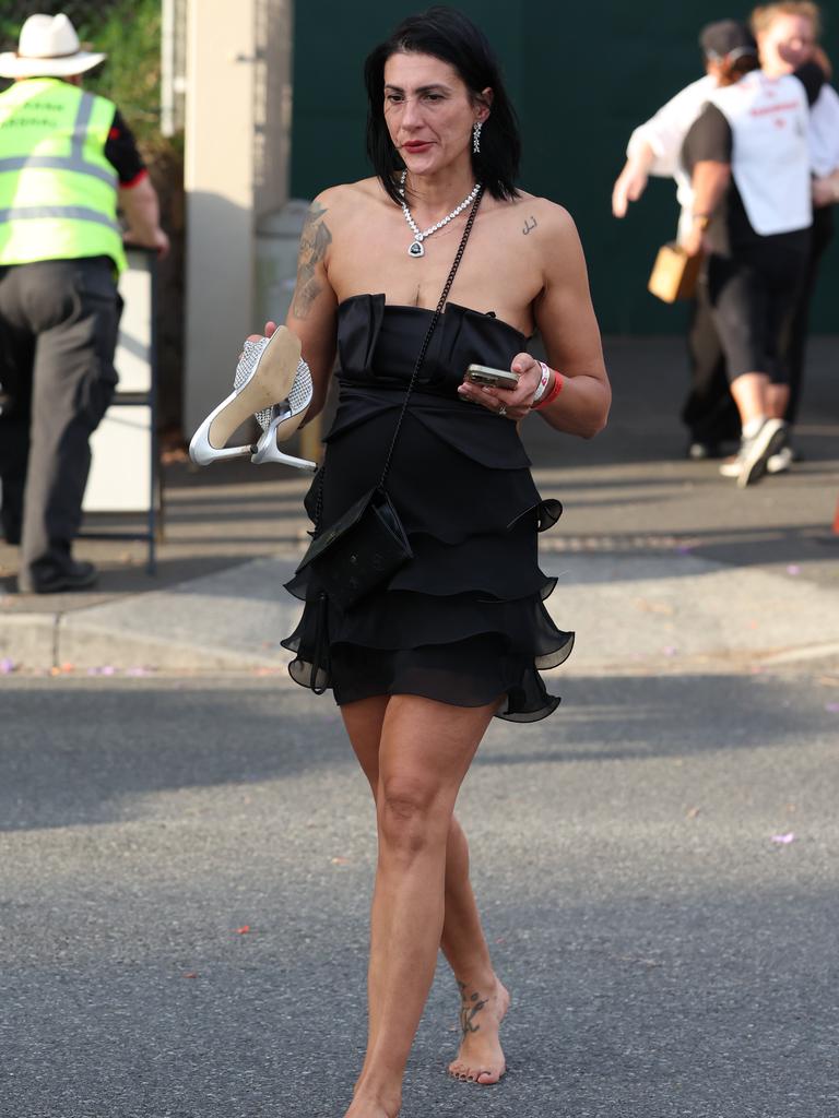 Punters leave Eagle Farm racecourse on Melbourne Cup Day.