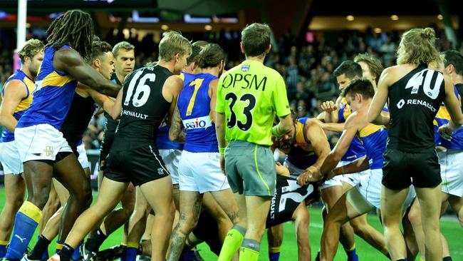 A melee breaks out after Tom Jonas knocked out Andrew Gaff. Picture: Mark Brake.