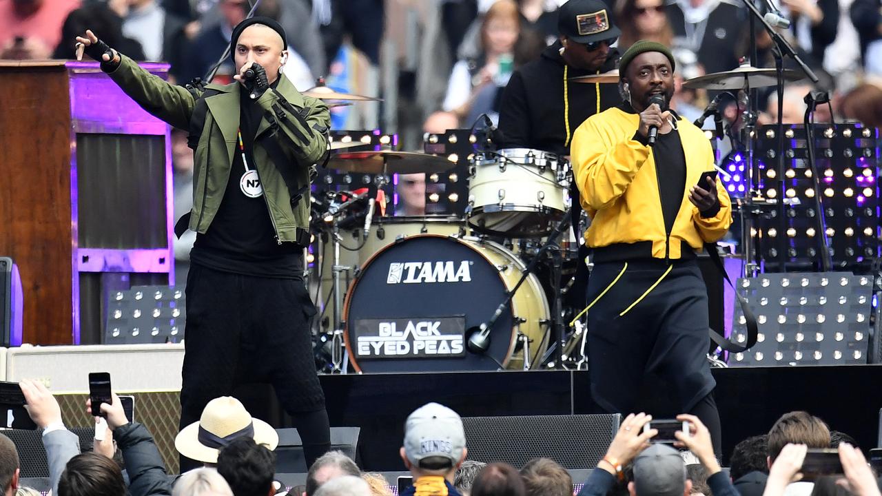 A twilight Grand Final will turn the halftime performances into a greater spectacle. The Black Eyed Peas performed before the 2018 flag decider. (AAP Image/Julian Smith) 