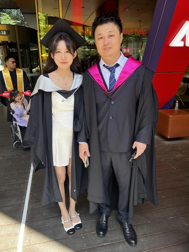 Junwei Zhang (Bachelor of Fashion Design) and Guangli Xu (Master of Art Management) at the RMIT University graduation day on Wednesday, December 18, 2024. Picture: Jack Colantuono