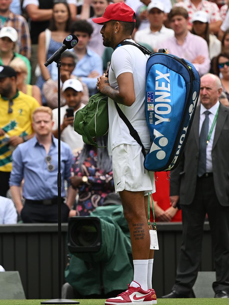 Nick Kyrgios breaks Wimbledon dress code wearing red Nike shoes hat video