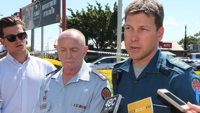 Acting senior operations supervisor QMBA Gavin Fuller and Critical Care Paramedic from the High Activity Response Unit Jaye Newton speak after the shooting. Photo: Mike Batterham