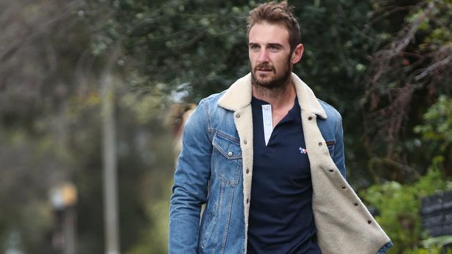 Banned Essendon captain Jobe Watson takes his dog for a walk. Picture: David Crosling