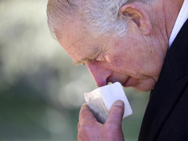 Prince Charles smells olive soap during a visit to Israel. Picture: Chris Jackson