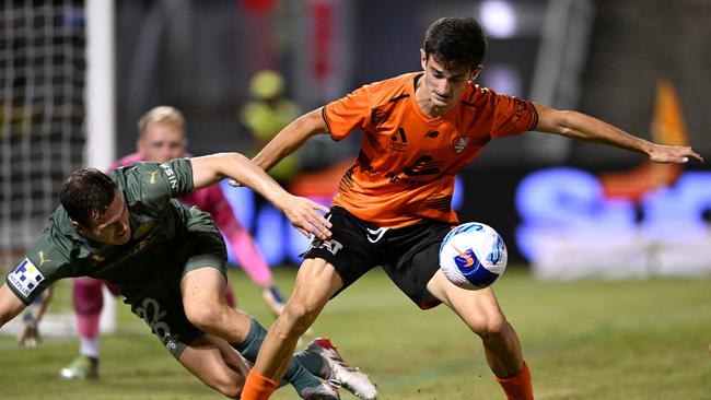 Curtis Good (left) stumbles as he tries to challenge Brisbane Roar’s Luke Ivanovic. Picture: Bradley Kanaris/Getty Images