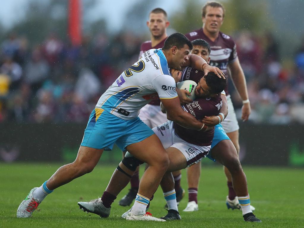 Josh Aloiai is monstered by David Fifita in round six. Picture: Mark Metcalfe/Getty Images