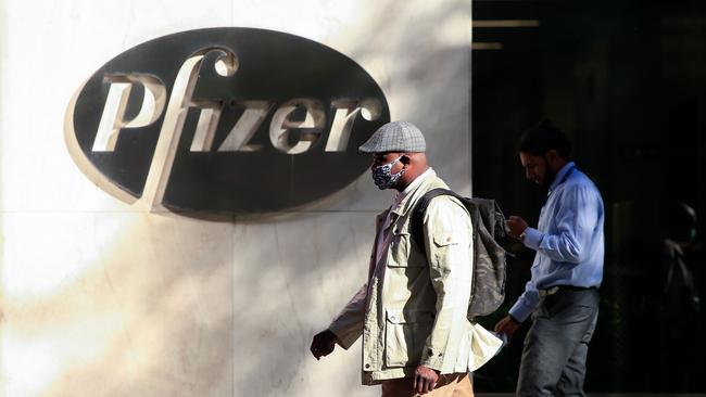 People walk by the Pfizer world headquarters in New York. Picture: AFP