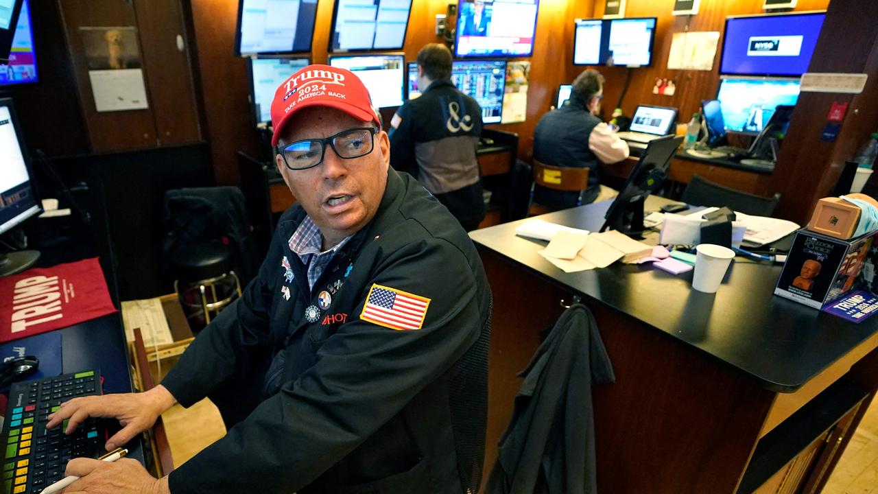 A trader wears a Trump hat as he works on the floor of the New York Stock Exchange. Picture: AFP