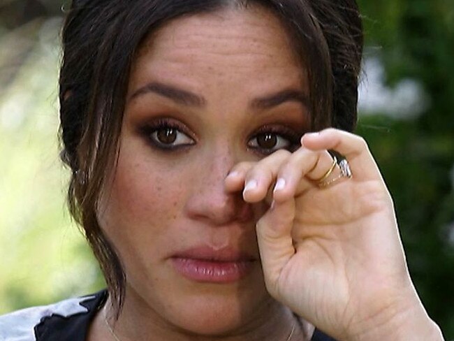 Meghan Markle wipes away tears during her CBS interview with Oprah Winfrey. Picture: Supplied