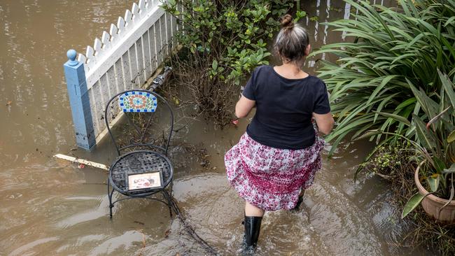 Lismore’s Jodie Lynch, whose family home was destroyed by the record-flood, returned to survey the damage. Picture: Darren Leigh Roberts