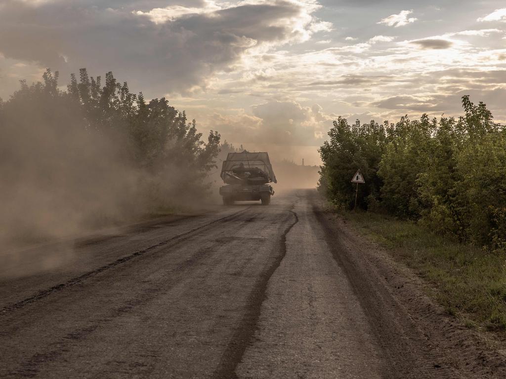 Ukrainian servicemen drive a Soviet-made T-64 tank in the Sumy region, near the border with Russia. Picture: AFP