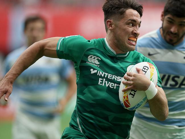 VANCOUVER, BRITISH COLUMBIA - MARCH 08: Greg O'Shea #8 of Ireland breaks away from German Shulz #3 of Argentina to score during their rugby sevens match at BC Place on March 08, 2020 in Vancouver, Canada. (Photo by Trevor Hagan/Getty Images)