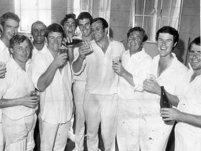 The SA cricket team celebrates after its outright victory over NSW at Adelaide Oval clinched the Sheffield Shield, 01 Mar 1971. In the dressing room are (l-r) Kevin McCarthy, Ashley Mallett, Mike Hendricks, John Causby, Ian Chappell, Jeff Hammond, Greg Chappell, Eric Freeman, Ken "K.G." Cunningham, Ashley Woodcock and Terry Jenner. (Pic by unidentified staff photographer)