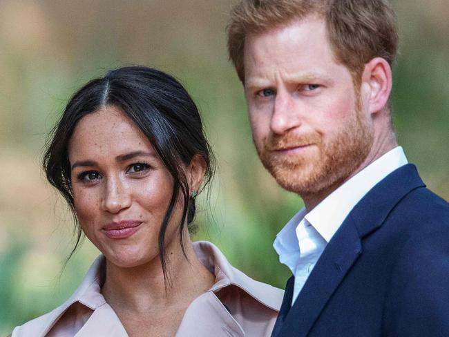 Britain's Prince Harry, Duke of Sussex(R) and Meghan, the Duchess of Sussex(L) arrive at the British High Commissioner residency in Johannesburg where they  will meet with Graca Machel, widow of former South African president Nelson Mandela, in Johannesburg, on October 2, 2019. - Prince Harry recalled the hounding of his late mother Diana to denounce media treatment of his wife Meghan Markle, as the couple launched legal action against a British tabloid for invasion of privacy. (Photo by Michele Spatari / AFP)