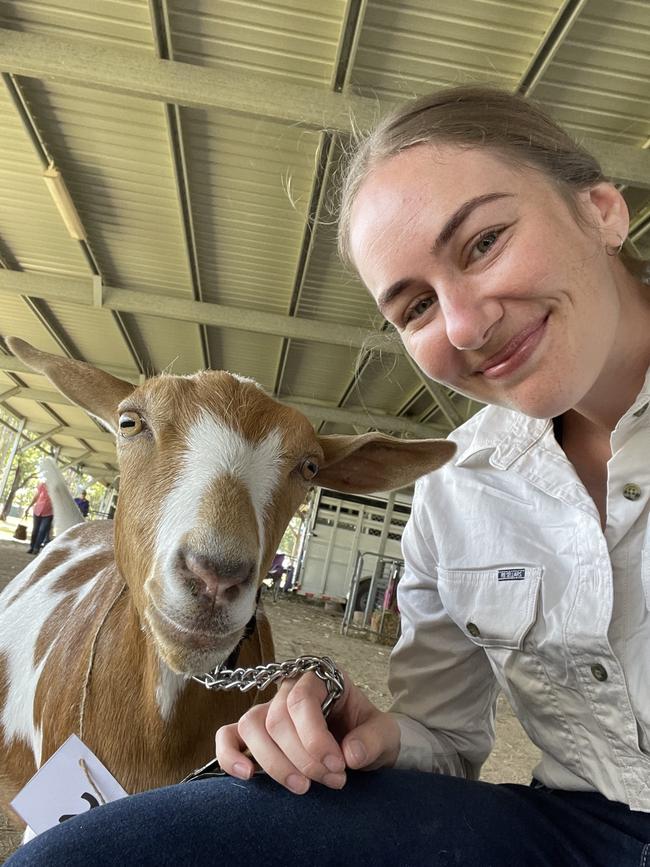 Sydney University student Alice Shirley with Rosebud the goat.