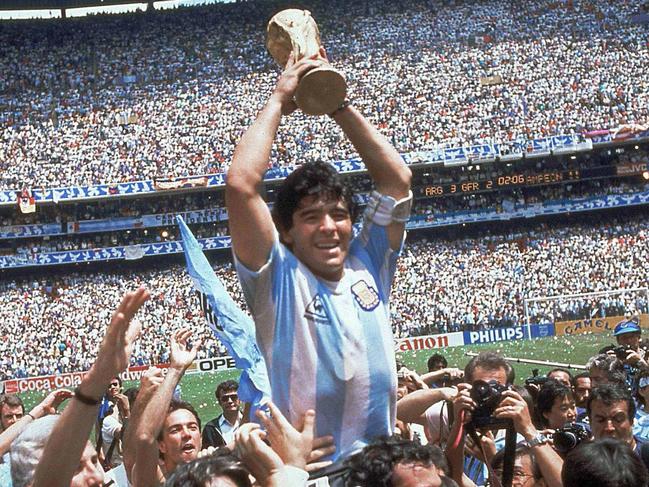 ** FILE ** In this June 29, 1986 file photo Diego Maradona of Argentina celebrates with the cup at the end of the World Cup soccer final in the Atzeca Stadium, in Mexico City, Mexico. A star who was addicted to drugs, sentenced to jail for shooting at reporters and punched the ball into the net in a World Cup quarterfinal doesn't seem like the ideal candidate to coach a national football team. But this is Diego Maradona, one of football's all-time greats who can do no wrong in the eyes of Argentina's fans. Maradona, who turns 48 on Thursday, and Carlos Bilardo have been asked to lead the national team by Julio Grondona, head of the Argentine Football Association. (AP Photo/Carlo Fumagalli, File)