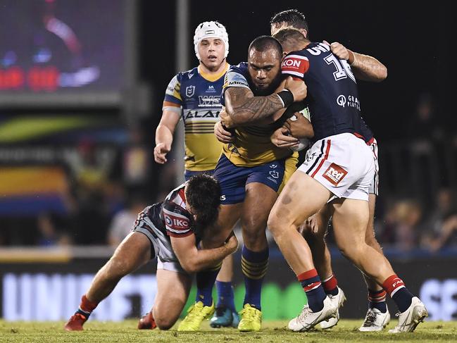 Junior Paulo of the Eels is tackled during the round 20 NRL match between the Sydney Roosters and the Parramatta Eels at BB Print Stadium in Mackay on July 29. Picture: Albert Perez/Getty Images