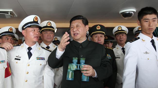 Chinese President Xi Jinping and the Chairman of the Central Military Commission inspect a Chinese Haikou Type 052C destroyer.